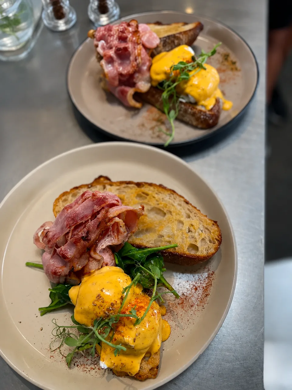 Eggs Benedict with bacon on sourdough