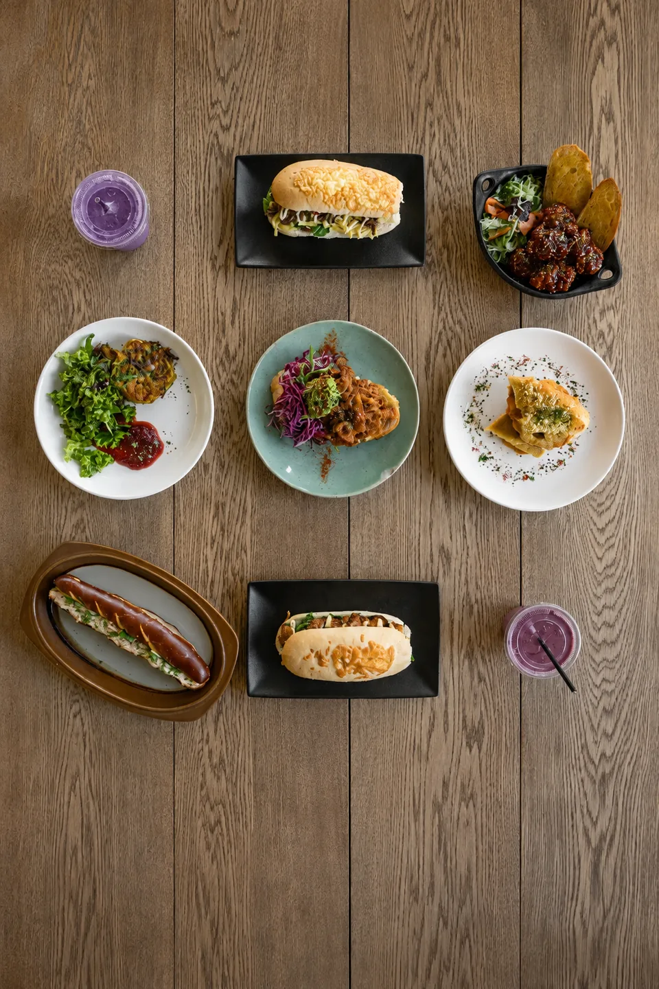 Plates and drinks arranged on a timber table